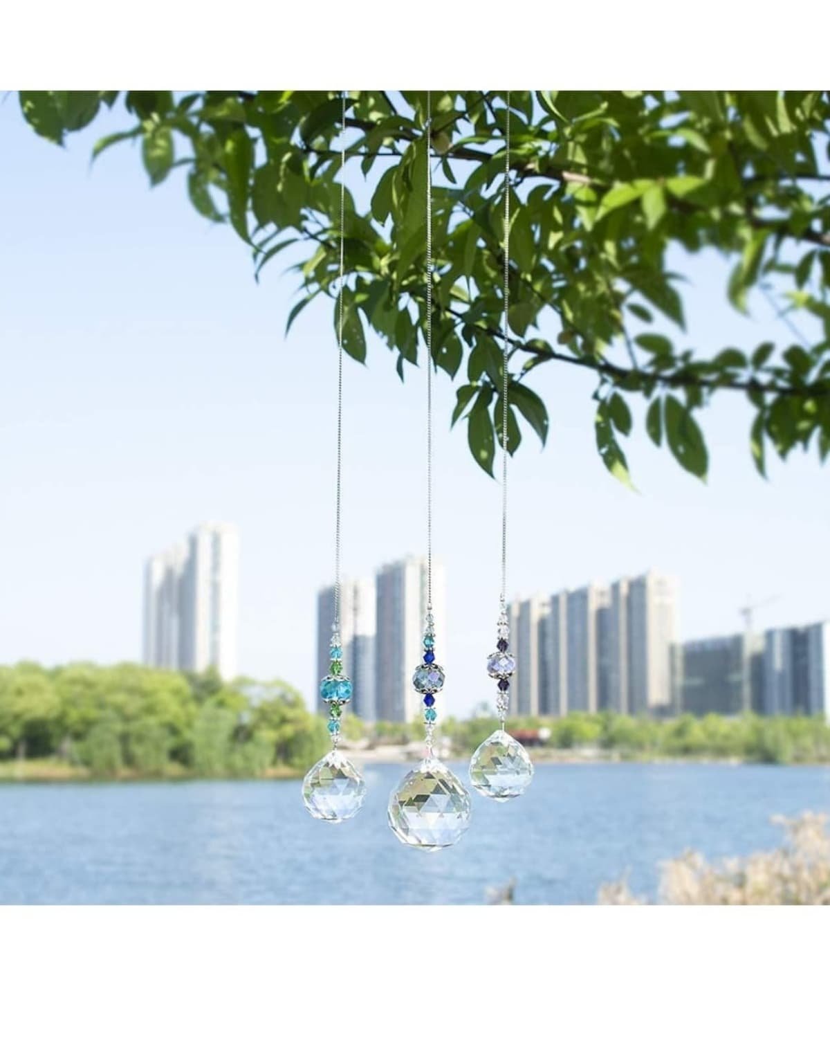 this is where to hang a crystal suncatcher. with plants sheer curtains and indoor plant decor