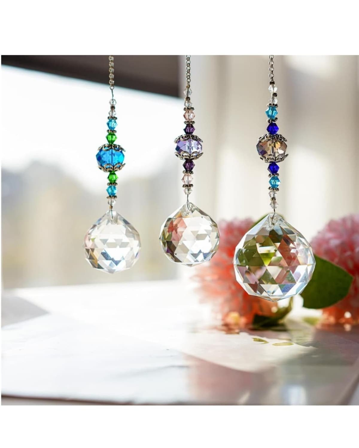 this is where to hang crystal suncatchers in your small apartment windows