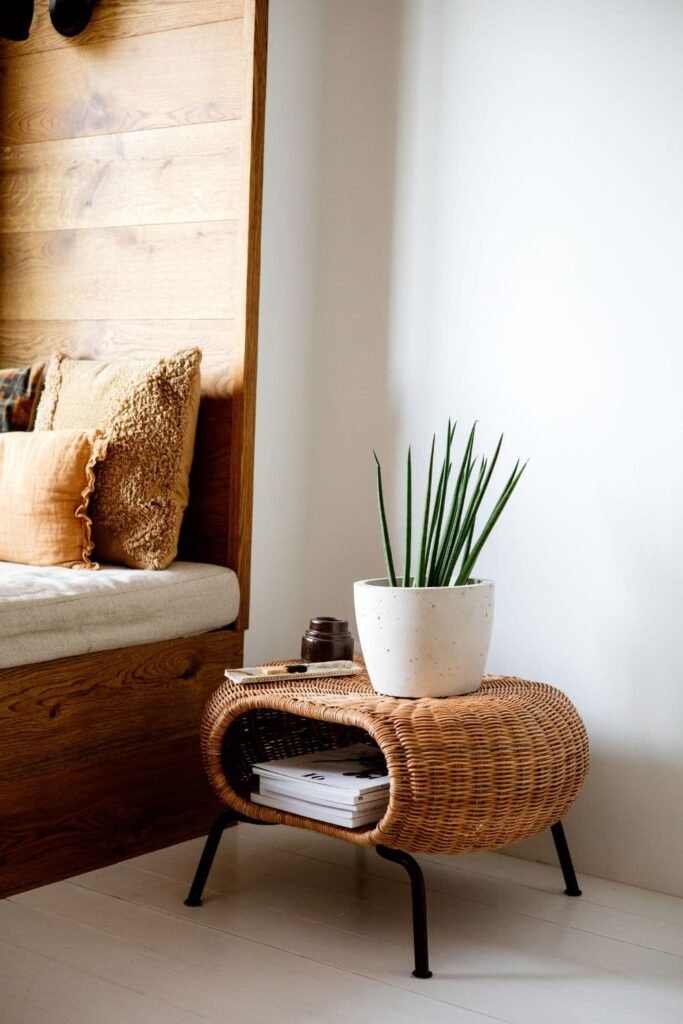 earthy bedroom ideas with rattan side table, and house plant